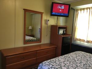 Postel nebo postele na pokoji v ubytování Pine Ridge Motel