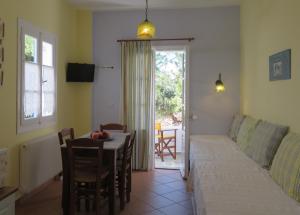 a living room with a couch and a table at Korali apartments in Galissas