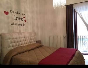 En eller flere senge i et værelse på San Sebastiano Apartment