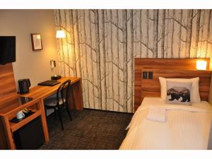 Posteľ alebo postele v izbe v ubytovaní Hotel Code Shinsaibashi
