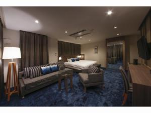 Posteľ alebo postele v izbe v ubytovaní Hotel Code Shinsaibashi