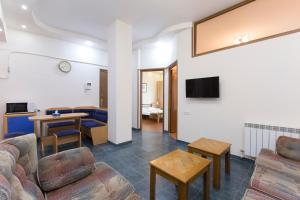 a living room with a couch and a table at Umba Apartment N1 - 2 bedrooms in Yerevan