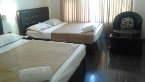 Postel nebo postele na pokoji v ubytování Rio Grande Residency