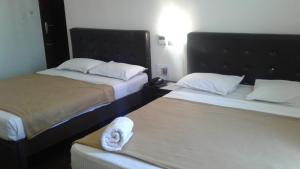 Postel nebo postele na pokoji v ubytování Rio Grande Residency