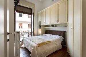 Postel nebo postele na pokoji v ubytování B&B Ortigia Bedda