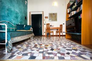 Postel nebo postele na pokoji v ubytování B&B Ortigia Bedda