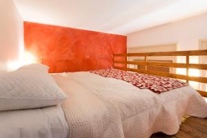 Postel nebo postele na pokoji v ubytování B&B Ortigia Bedda