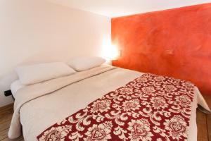 Postel nebo postele na pokoji v ubytování B&B Ortigia Bedda