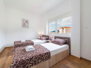 En eller flere senge i et værelse på Apartments Bel&Rus Hestia