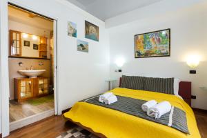 Postel nebo postele na pokoji v ubytování B&B Ortigia Bedda