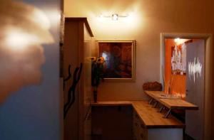 a room with a wooden table and a refrigerator at Art And Relax Suites in Rome +32 photos