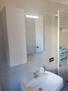 Koupelna v ubytování Como Ricky Apartment + 18 fotografií