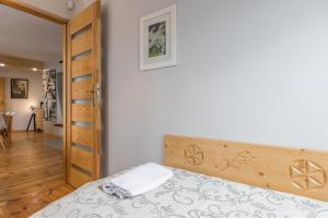Posteľ alebo postele v izbe v ubytovaní Apartament Marmurki Zakopane