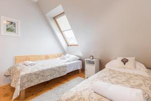 Posteľ alebo postele v izbe v ubytovaní Apartament Marmurki Zakopane