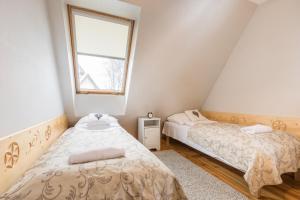 Posteľ alebo postele v izbe v ubytovaní Apartament Marmurki Zakopane