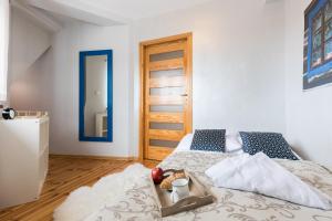 Posteľ alebo postele v izbe v ubytovaní Apartament Marmurki Zakopane