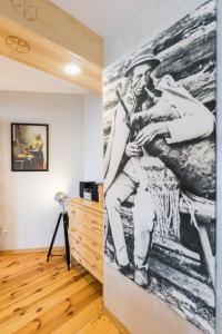 Televízia a/alebo spoločenská miestnosť v ubytovaní Apartament Marmurki Zakopane