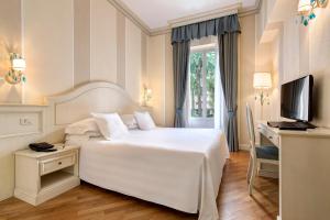 Кровать или кровати в номере Hotel Cenobio Dei Dogi