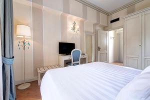 Кровать или кровати в номере Hotel Cenobio Dei Dogi