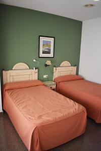 Postel nebo postele na pokoji v ubytování Hotel Los Bartolos