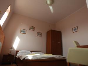 Postel nebo postele na pokoji v ubytování Pensiunea Caramell