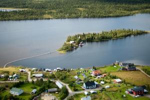 an island in the middle of a large body of water at Aurora Nova in Koskullskulle