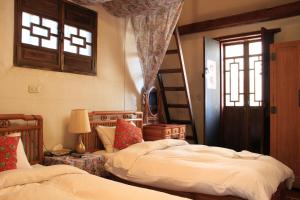 Katil atau katil-katil dalam bilik di Love nostalgia No. 53 B&B