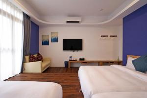 Een TV en/of entertainmentcenter bij Penghu Little Apple B&B
