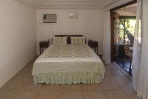 En eller flere senge i et værelse på Barracuda Eco Resort Búzios