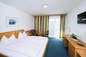 TV a/nebo společenská místnost v ubytování Hotel Reichmann