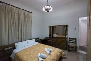 Postel nebo postele na pokoji v ubytování Flisvos Rooms + 37 fotografií