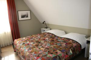 Postel nebo postele na pokoji v ubytování B&B 't Meulweegje