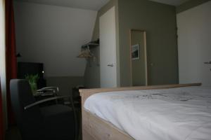Postel nebo postele na pokoji v ubytování B&B 't Meulweegje