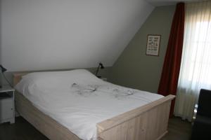 Postel nebo postele na pokoji v ubytování B&B 't Meulweegje