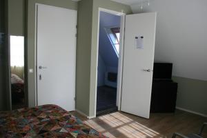 Postel nebo postele na pokoji v ubytování B&B 't Meulweegje