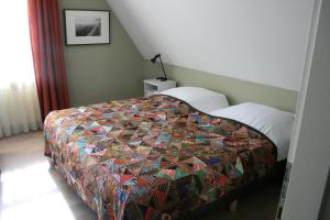 Postel nebo postele na pokoji v ubytování B&B 't Meulweegje