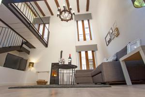 a living room with a couch and a fireplace at Casa Severina in Alcoy