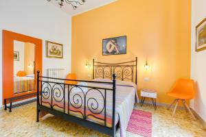 Postel nebo postele na pokoji v ubytování 2 Passi Al Colosseo B&B