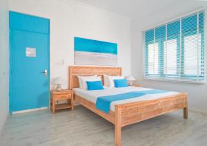 Postel nebo postele na pokoji v ubytování Villa Rosa Maldives