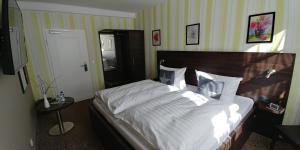 Krevet ili kreveti u jedinici u okviru objekta Hotel Alte Brennerei