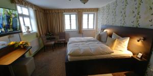 Krevet ili kreveti u jedinici u okviru objekta Hotel Alte Brennerei