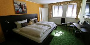 Krevet ili kreveti u jedinici u okviru objekta Hotel Alte Brennerei