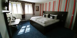 Krevet ili kreveti u jedinici u okviru objekta Hotel Alte Brennerei