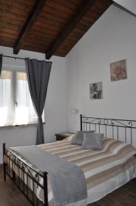 Een bed of bedden in een kamer bij Il Girasole
