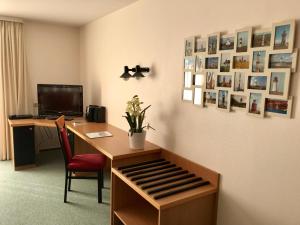 TV a/nebo společenská místnost v ubytování Steiner Strandappartements Appartement 308 Süd- Landseite