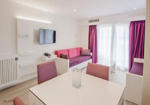 a living room with a couch and a table at Apartamentos Ponent in Paguera