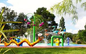 a water park with a fountain with animals on it at Le Ruisseau - EuroResorts Bidart in Bidart