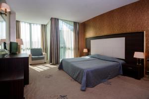 Postel nebo postele na pokoji v ubytování Hotel Primorsko Del Sol