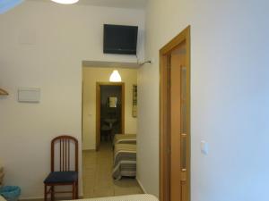 TV a/nebo společenská místnost v ubytování Hostal Fenix