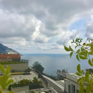 a view of the ocean from a building at Hotel Villa Delle Palme in Positano in Positano